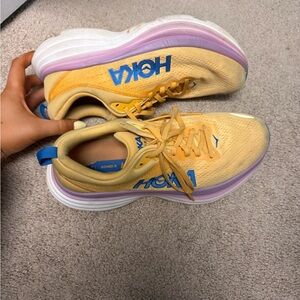 Hoka Vibrant Yellow and Soft Purple Running Shoes